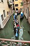 Venice Italy travel photo - Gondolas navigate a canal in Venice Italy