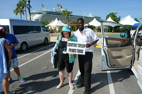 Courtney Taylor with Courtney Taylor Tours poses with Q in front of our cruise ship. Courtney Taylor Tours is  a private excursion company at the Jamaica port for Royal Caribbean's Navigator of the Seas on our Caribbean Cruise vacation