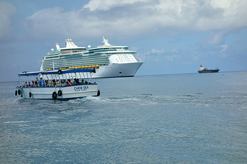 Royal Caribbean's Navigator of the Seas and a ferry boat carrying passengers at this tender port on our Caribbean Cruise vacation